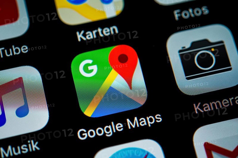 Smartphone screen displaying Google Maps and Camera apps in detail