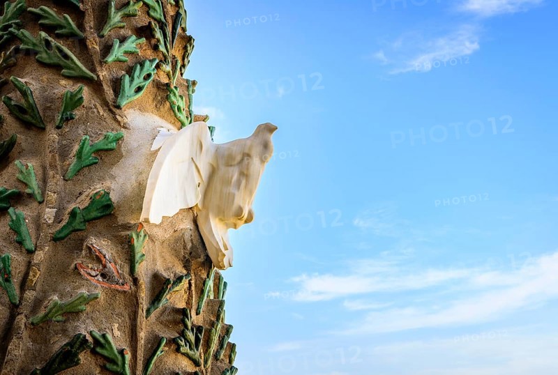 White dove of peace on the facade of the Sagrada Familia