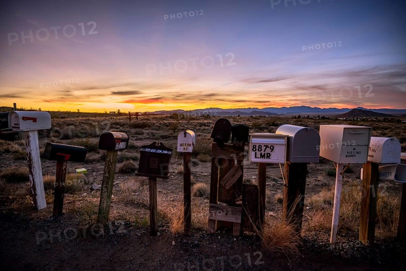 Roadside mailboxes at sunset