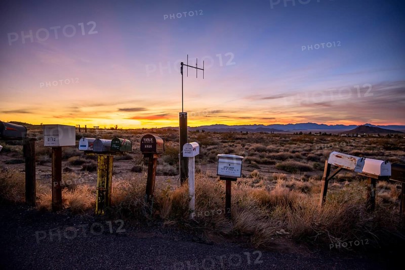 Roadside mailboxes at sunset