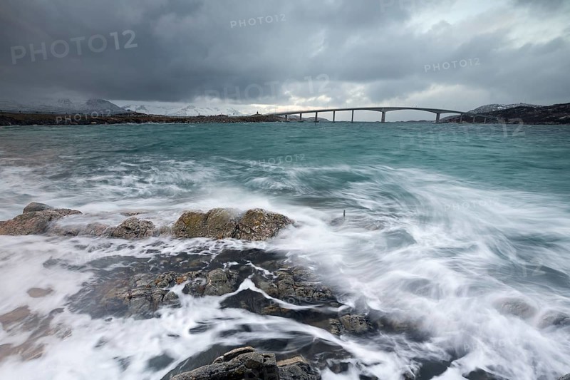 Bad weather and stormy sea with car bridge to Sommaroy