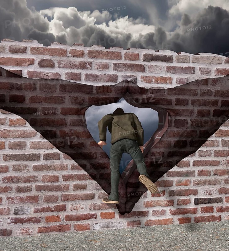 Man climbs through Merkel diamond on a Wall