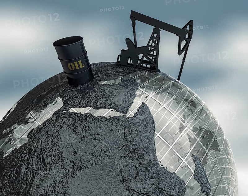 Globe with oil barrel and drilling rig