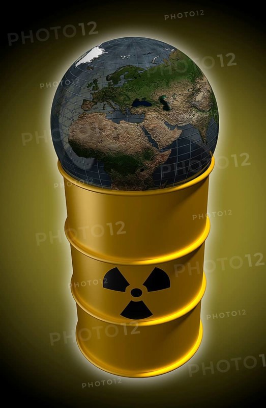 Globe lying on barrel with nuclear waste