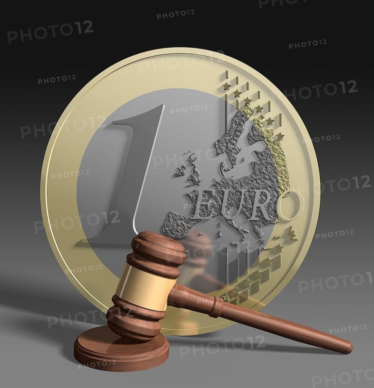 Gavel in front of euro coin