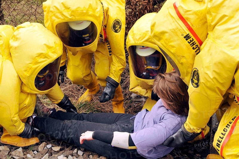 Firefighters in protective suits