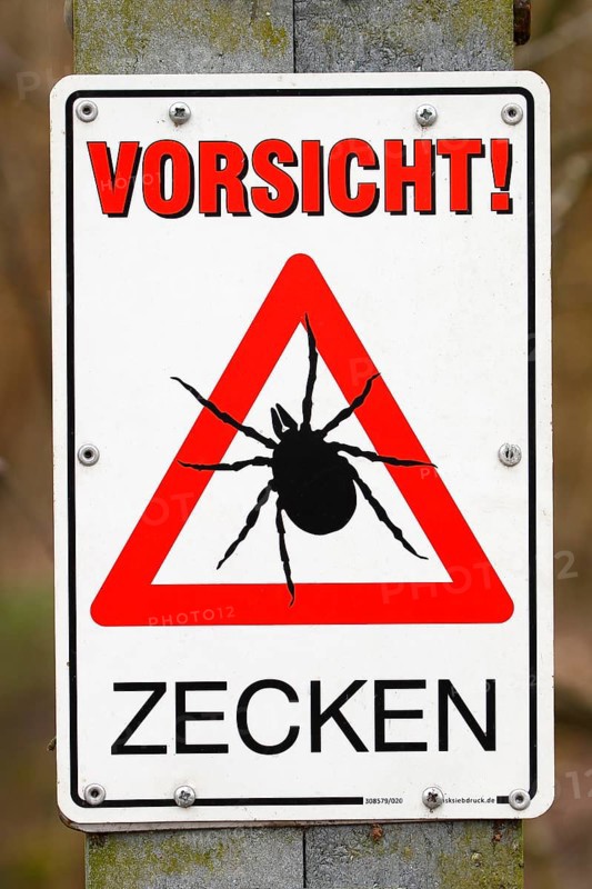 Warning sign Caution ticks
