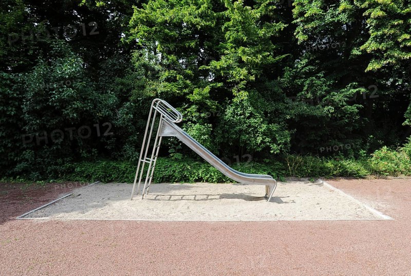 Lonely children's playground with slide and sandpit without children