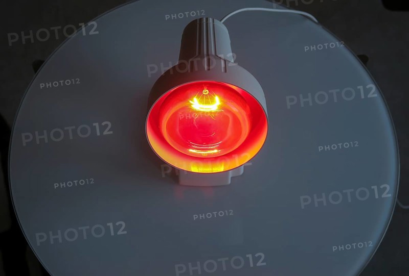 Luminous infrared lamp on the table