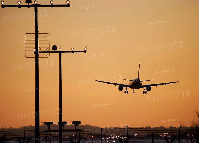 Approach aircraft at sunset