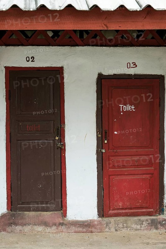 Toilet hut with red doors