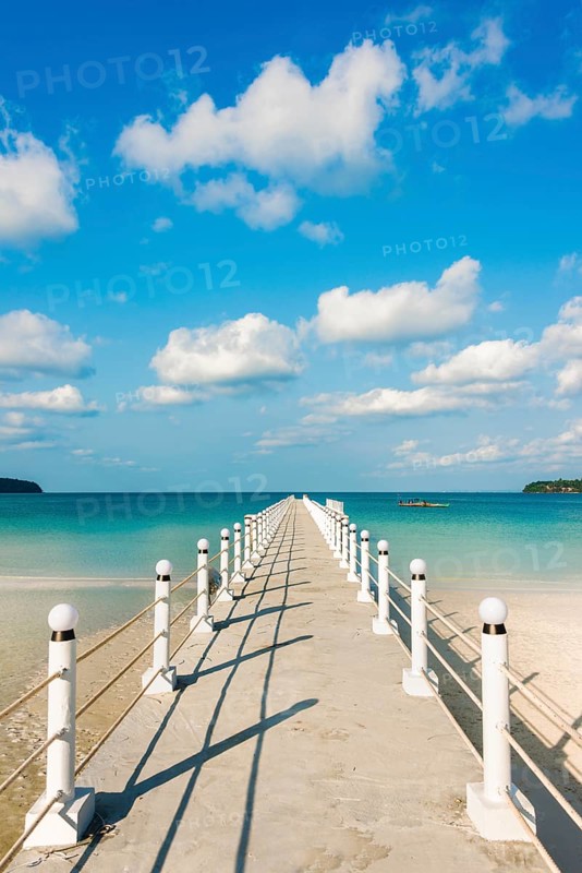 Pier on beach with turquoise water at Saracen Bay on Koh Rong Sanloem island