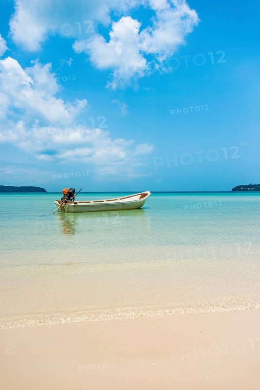 Motorboat on idyllic sandy beach