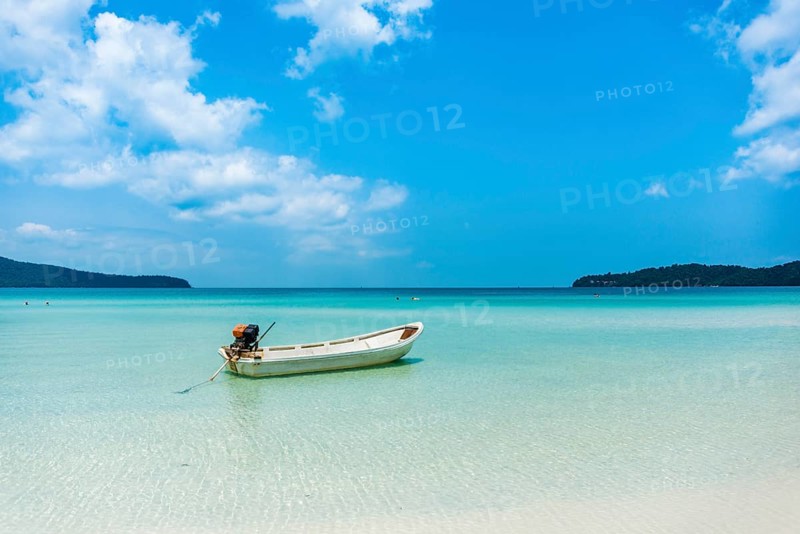 Motorboat on idyllic sandy beach