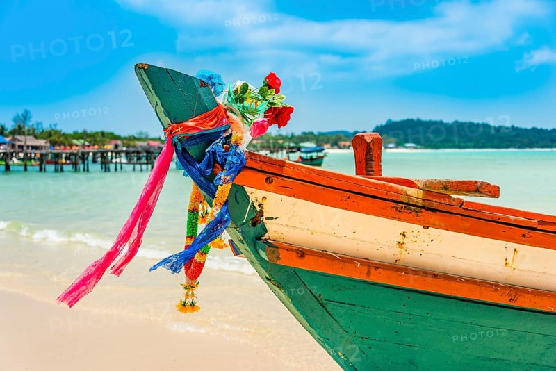 Idyllic sandy beach with traditional long-tail boat at Long Beach