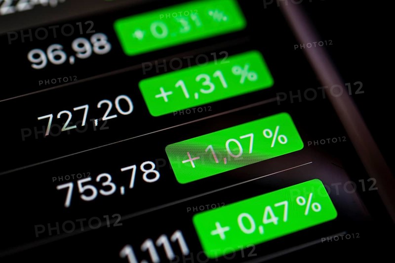 Close up of rising stock prices on smartphone screen