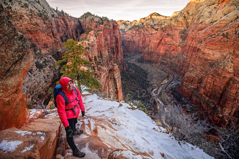 Young woman descending from Angels Landing