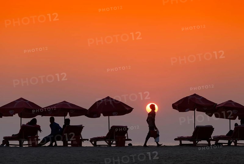 Silhouette of seller of tea on the beach in Cox's Bazar