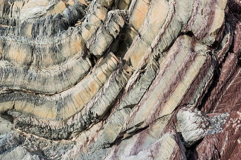 Limestone coloured red by iron and whitish-yellow dolomite