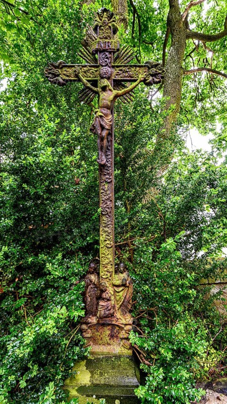 Old grave cross in the cemetery next to the ghost church of Lukova