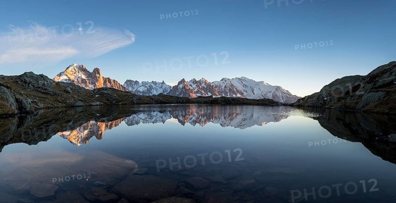 Panorama of Mont Blanc massif with reflection in the Lac des Chesery