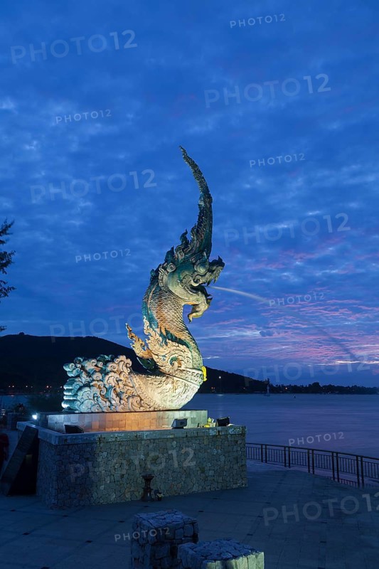 Dragon fountain at night on the promenade in Songkhla