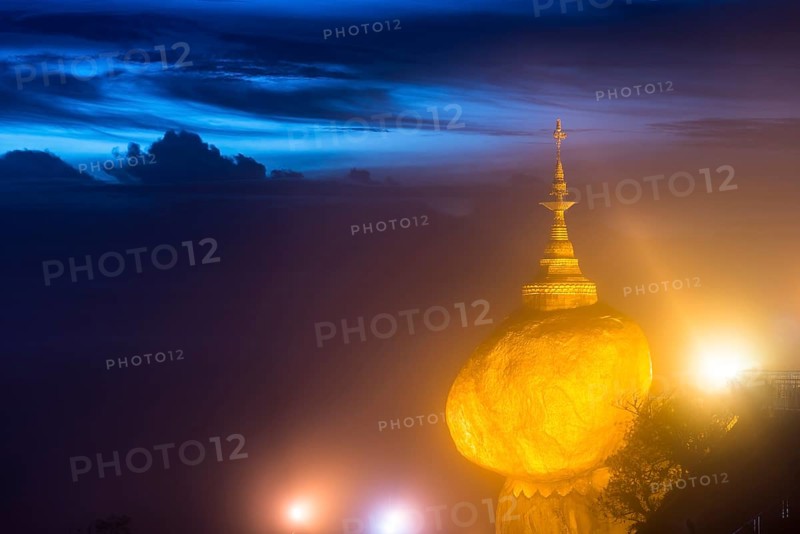 Illuminated Golden Rock at night with Kyaiktiyo Pagoda