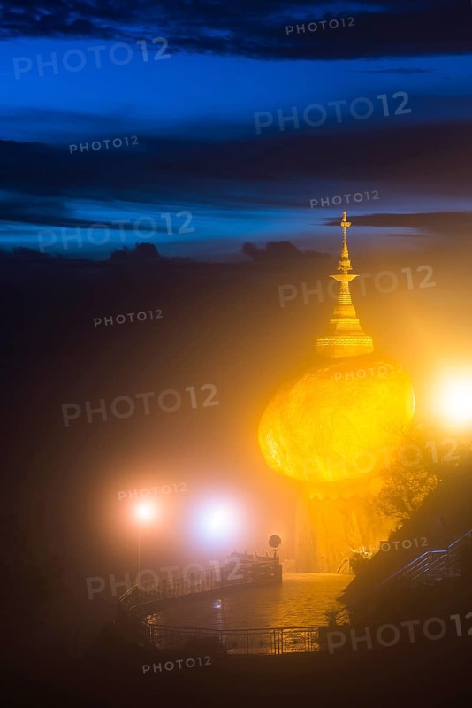 Illuminated Golden Rock at night with Kyaiktiyo Pagoda