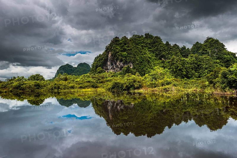 Karst hills with dark clouds