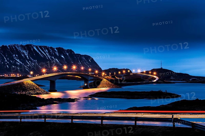 Illuminated bridge to the village Fredvang