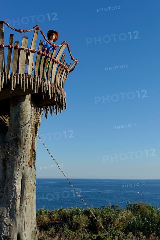 Girl standing on lookout tower at Cape Kamenjak