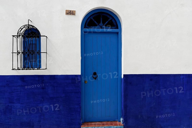 Housing front with blue front door