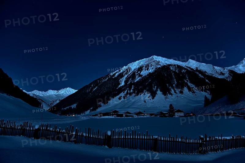 Farming village at night with starry sky in winter