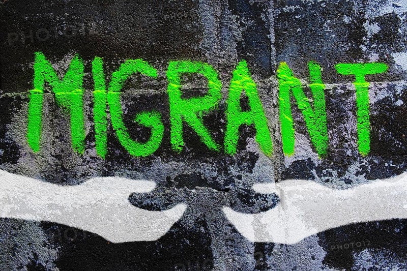 Graffiti on migration reading migrant