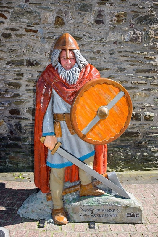 Tourist behind Viking figure