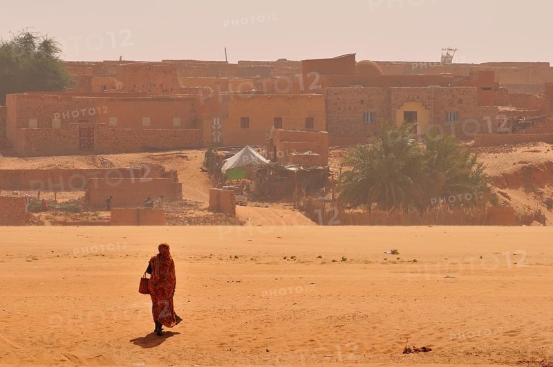 Woman in a dry riverbed