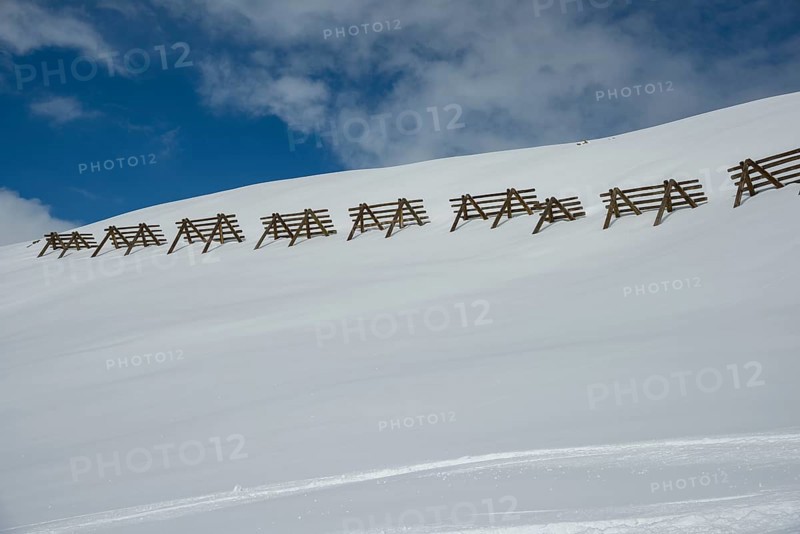 Avalanche control on the mountain slope with snow