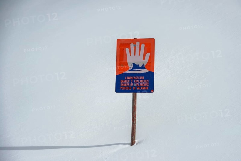 Avalanche warning sign in the snow