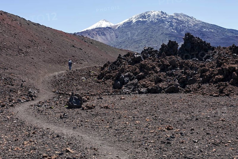 Hiker in volcanic landscape