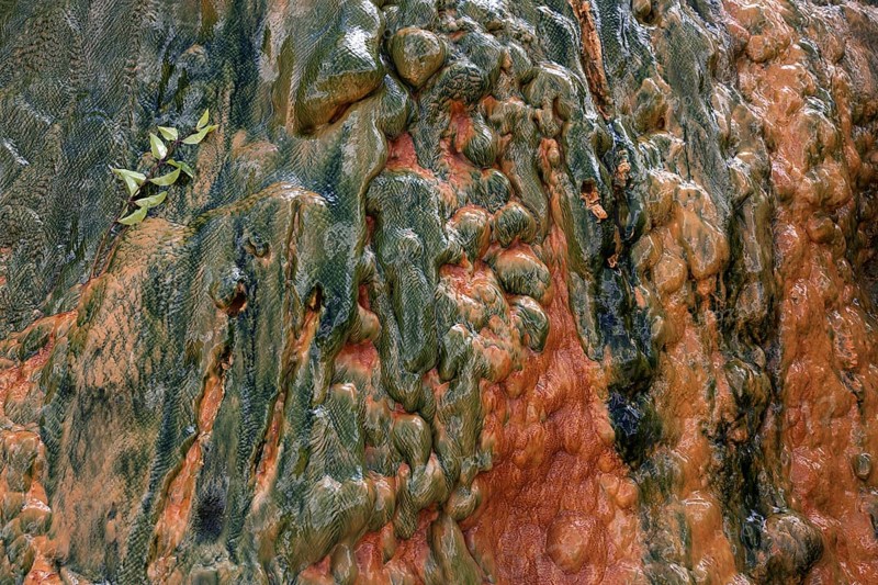 Colored mineral deposits in a thermal spring in Cilaos Cirque de Cilaos