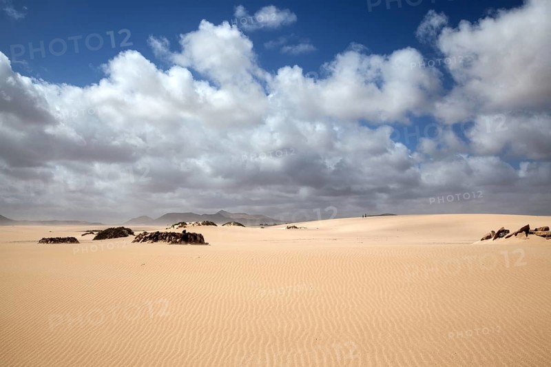 Sand dune with clouds