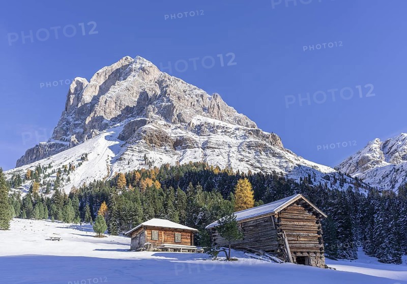 Mountain hut in front of Peitlerkofel with snow