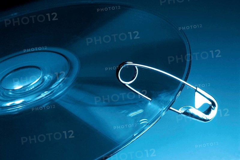 CD-ROM symbolically fastened with safety pin