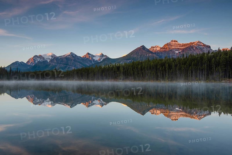 The Bow Range reflected in Herbert Lake at dawn