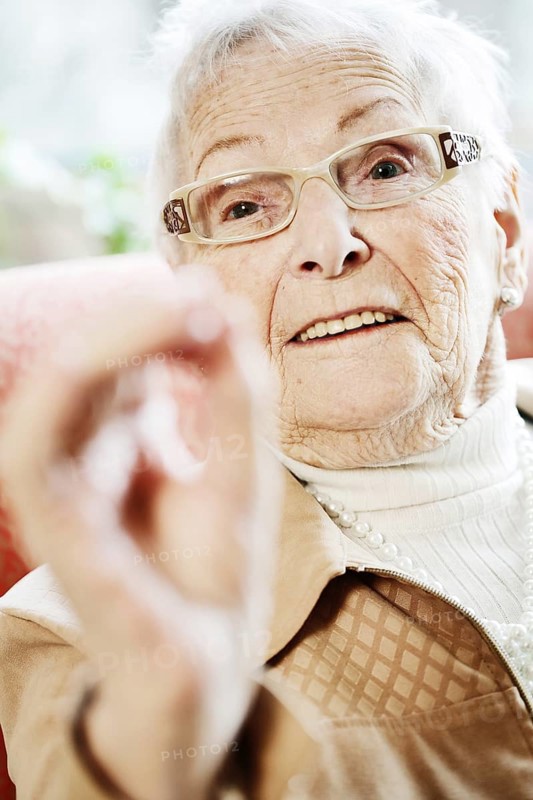 Senior suffering from dementia in her room at the nursing home