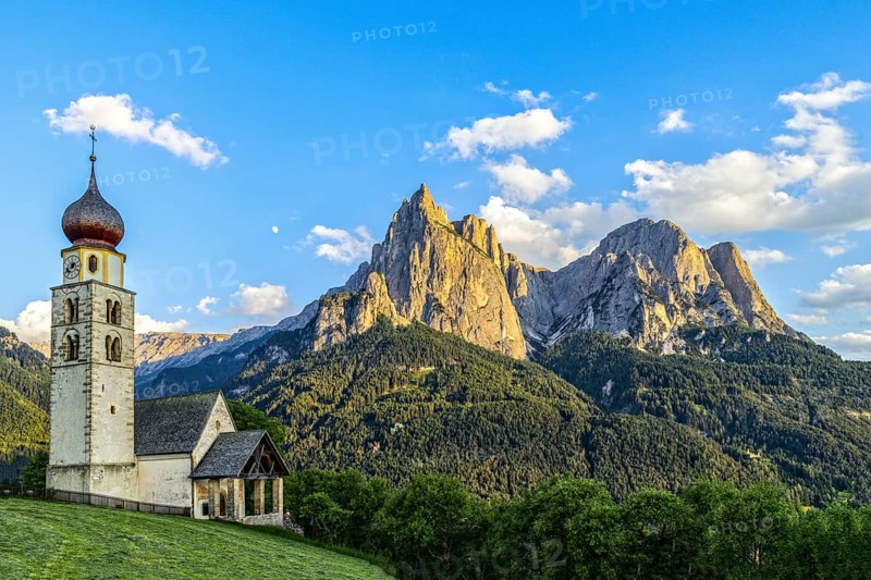 San Valentino church in front of the Schlern and moon at sunset