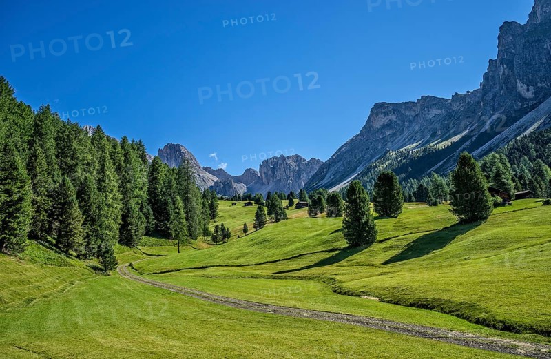 Odle mountain range in summer with Mt Stevia and the peaks of La Piza and Jela