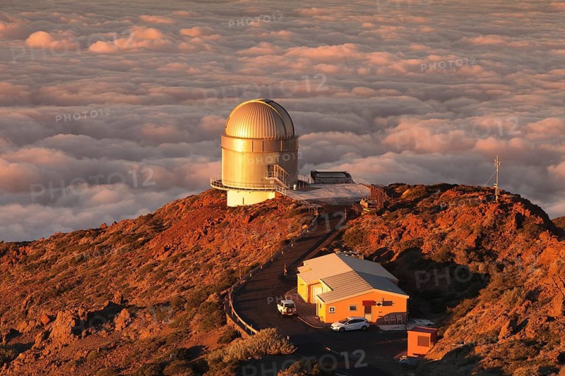 Observatory on the Roque de los Muchachos with clouds at sunset