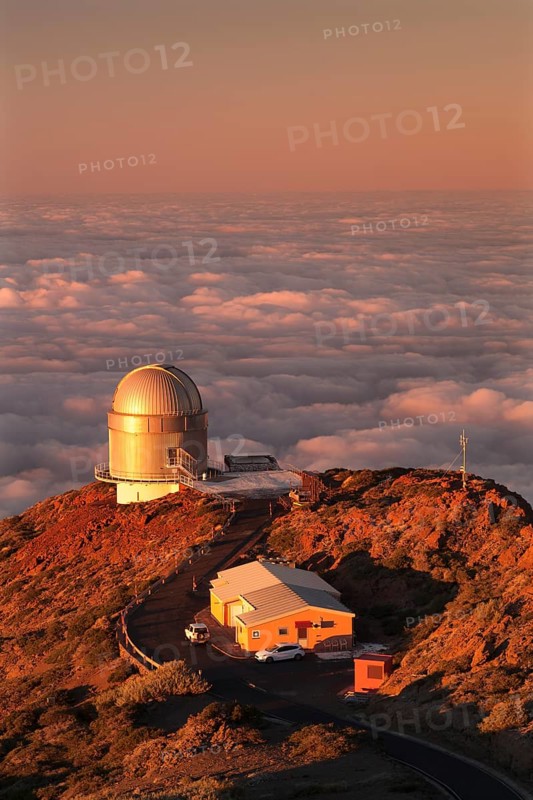 Observatory on the Roque de los Muchachos with clouds at sunset