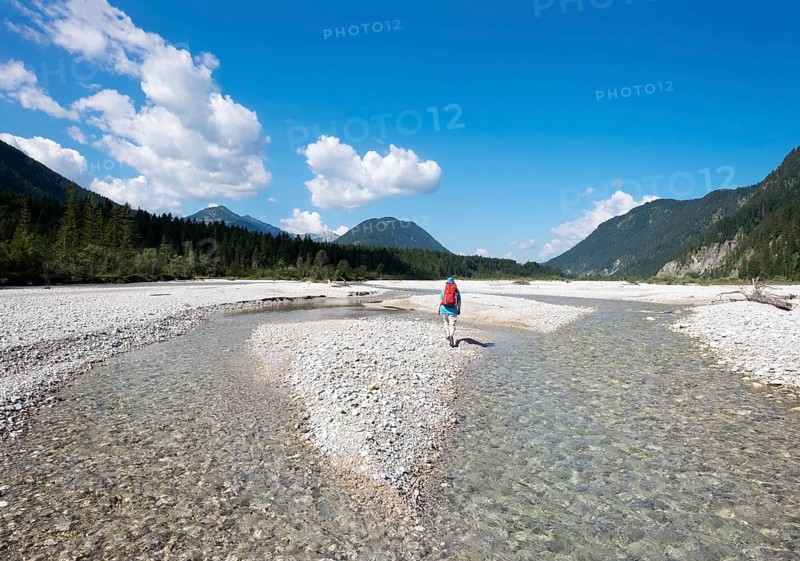 Woman trekking on gravel